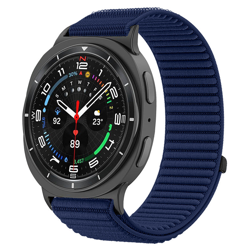 Black smartwatch with colorful digital display and navy blue textured sports loop band