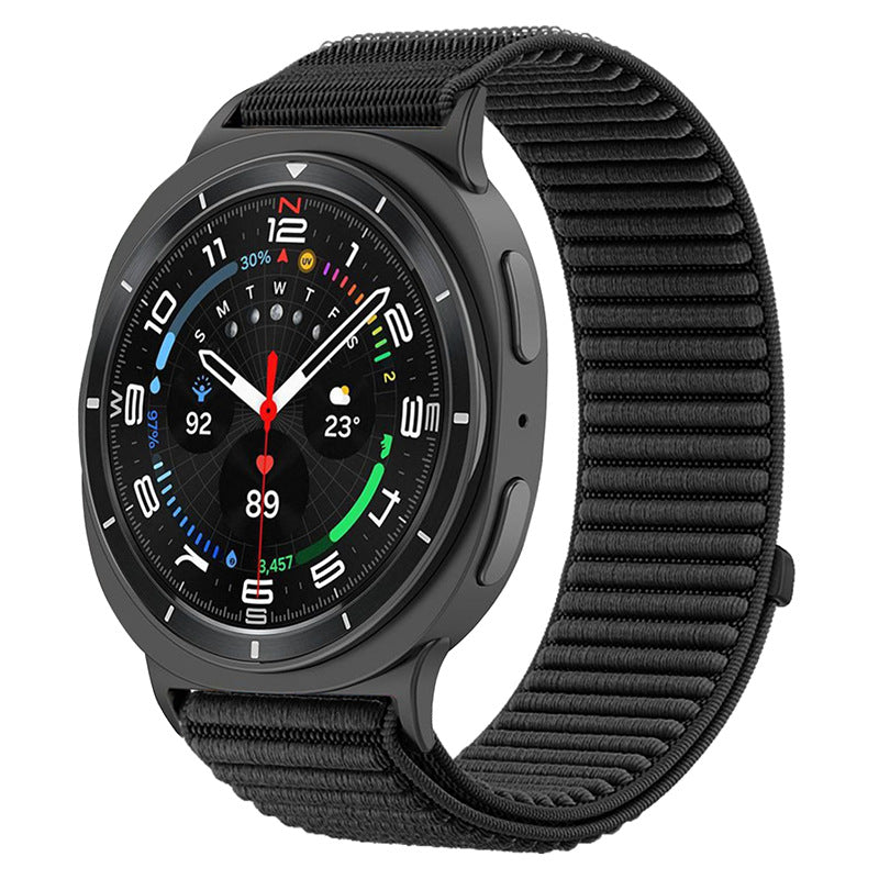 Black smartwatch with colorful digital display and matching black fabric sports loop band