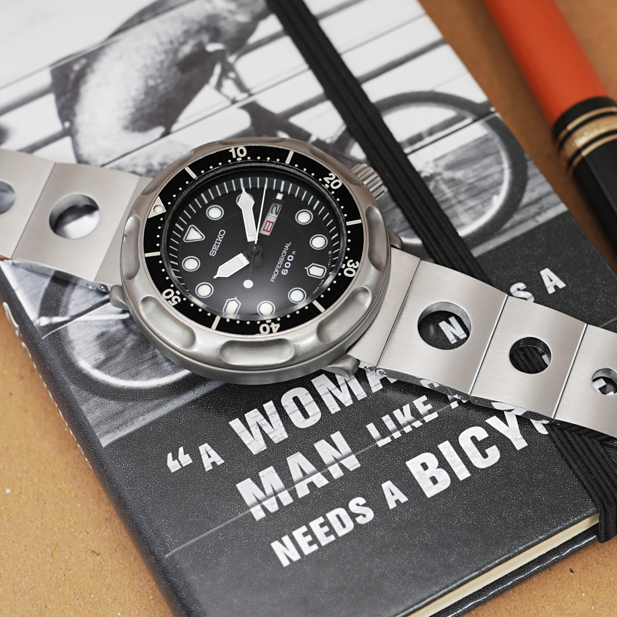 Seiko professional diver watch with stainless steel quick release bracelet and deployant clasp on book