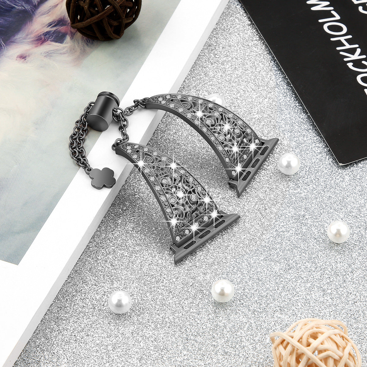 Black stainless steel filigree watch band bracelet with ornate geometric pattern and chain link connector for Apple Watch