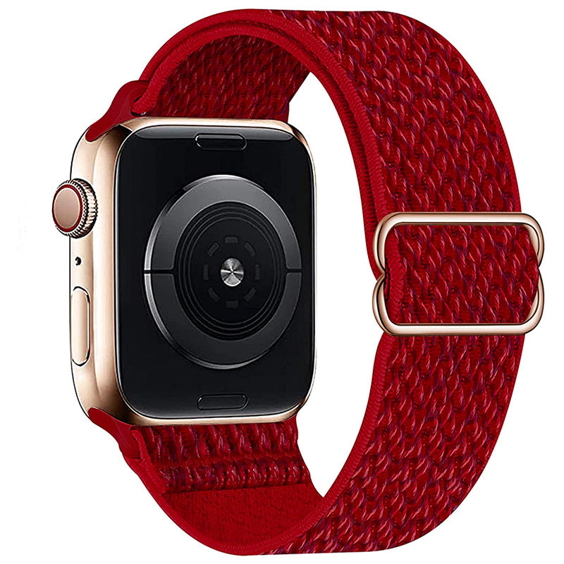 Gold smartwatch with red woven fabric loop band and adjustable buckle closure