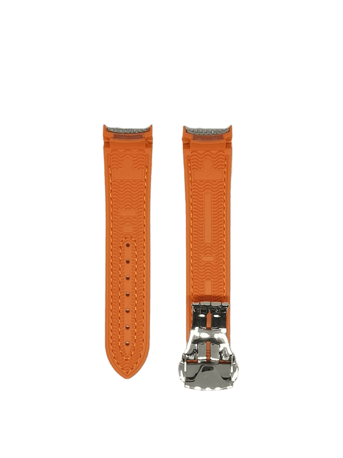Orange rubber curved watch strap with silver deployant clasp and grey textile backing
