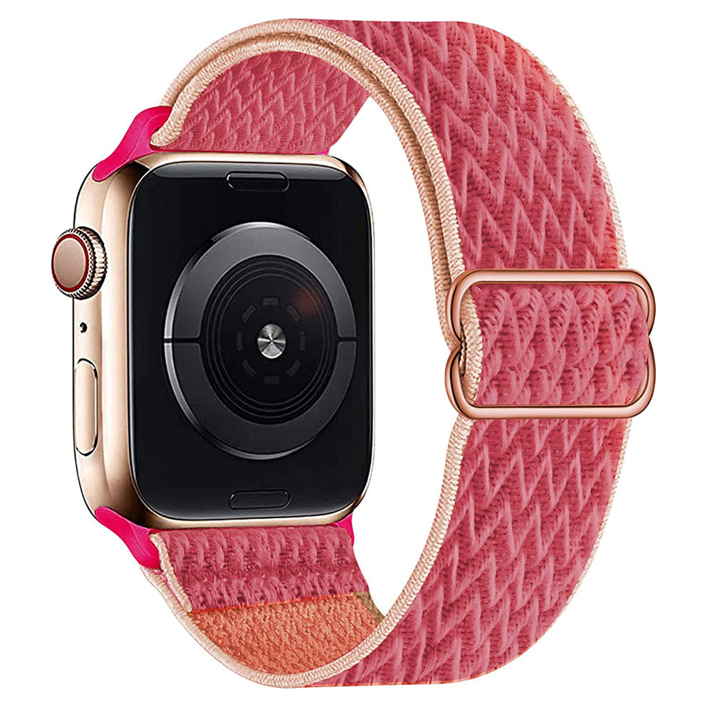 Pink woven fabric loop band for Apple Watch with rose gold buckle and clasp detail