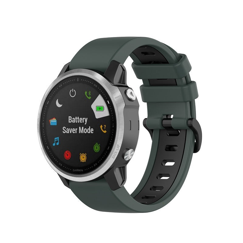 Garmin smartwatch with forest green silicone band displaying battery saver mode on black face with app icons