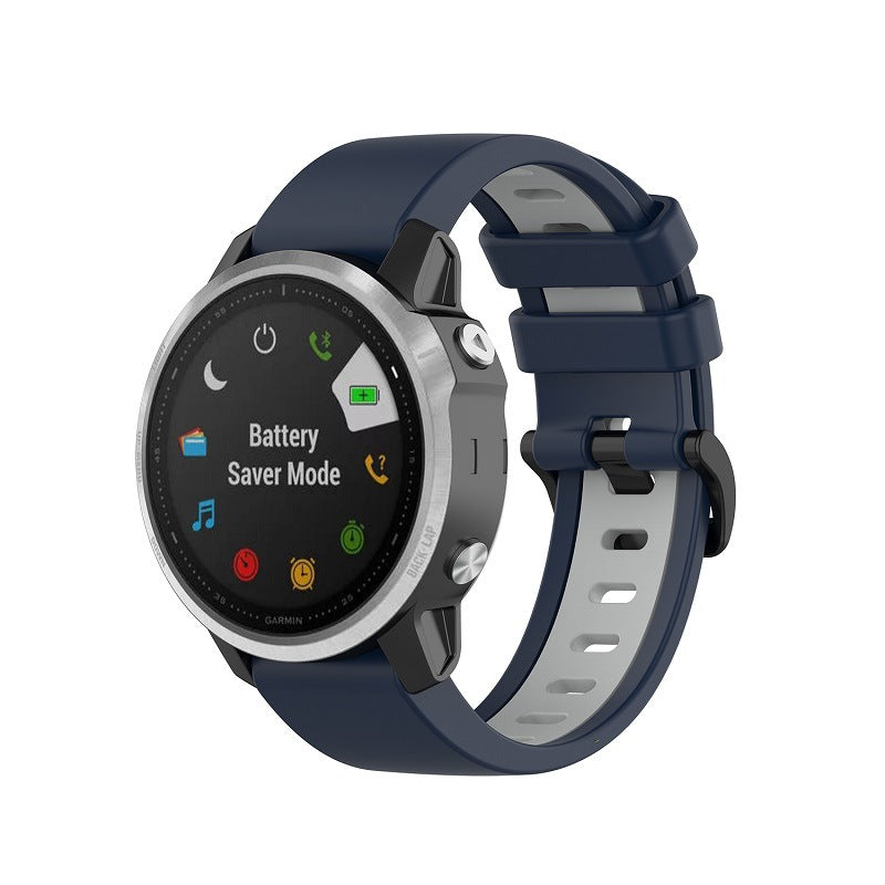 Garmin smartwatch with navy blue silicone band displaying battery saver mode and app icons on black dial