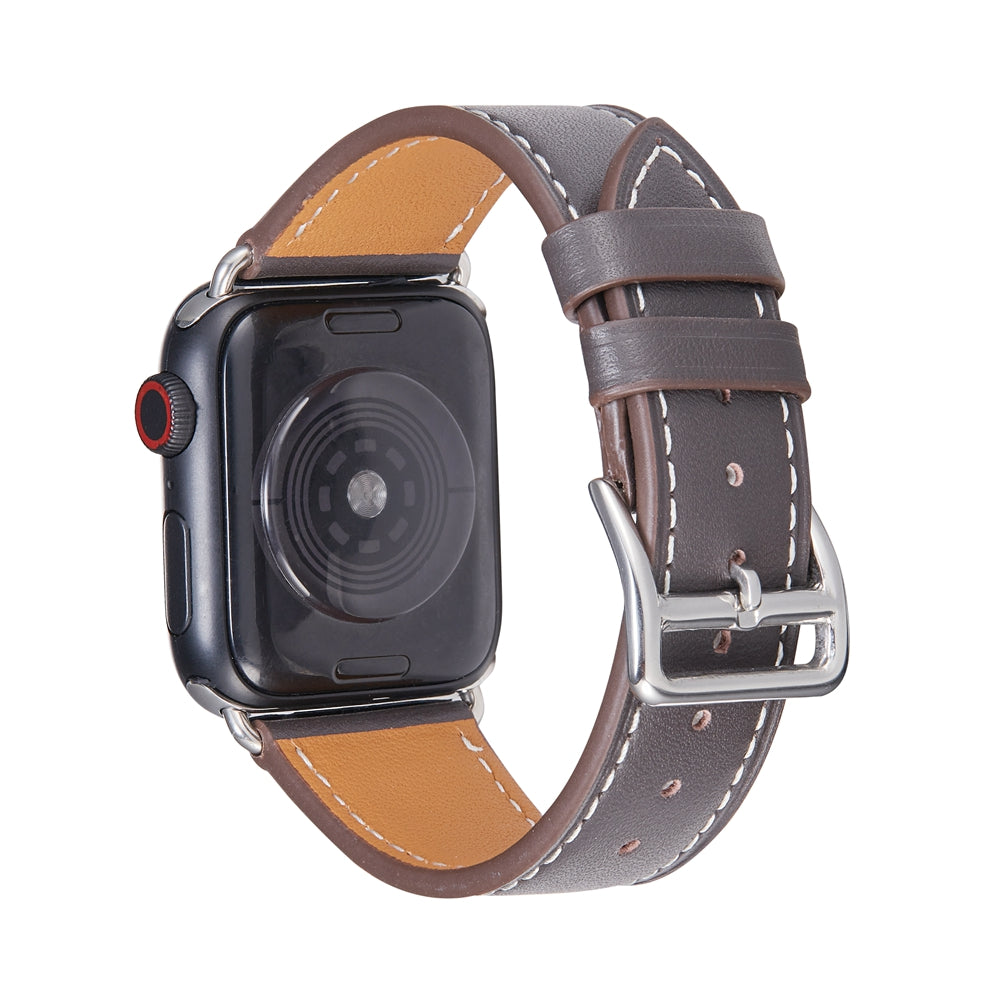 Dark brown leather single tour band for Apple Watch with tan interior, contrast stitching, and silver buckle closure