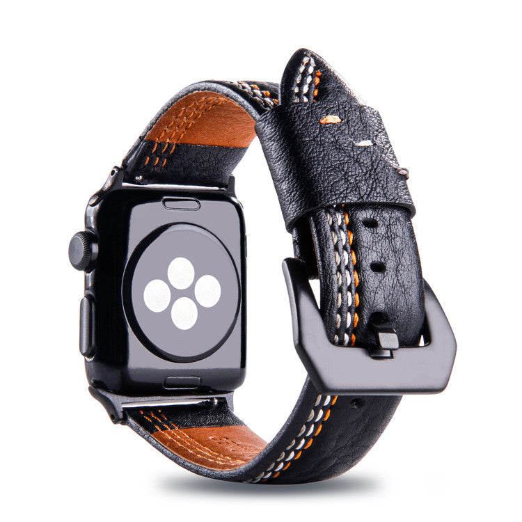 Black leather Apple Watch band with asymmetrical orange and white stitching, tan interior lining, and stainless steel buckle