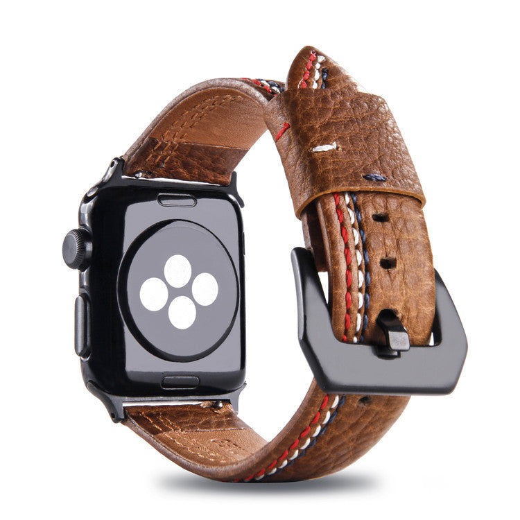 Brown leather Apple Watch band with asymmetrical red and white stitching, genuine leather strap with metal buckle connector