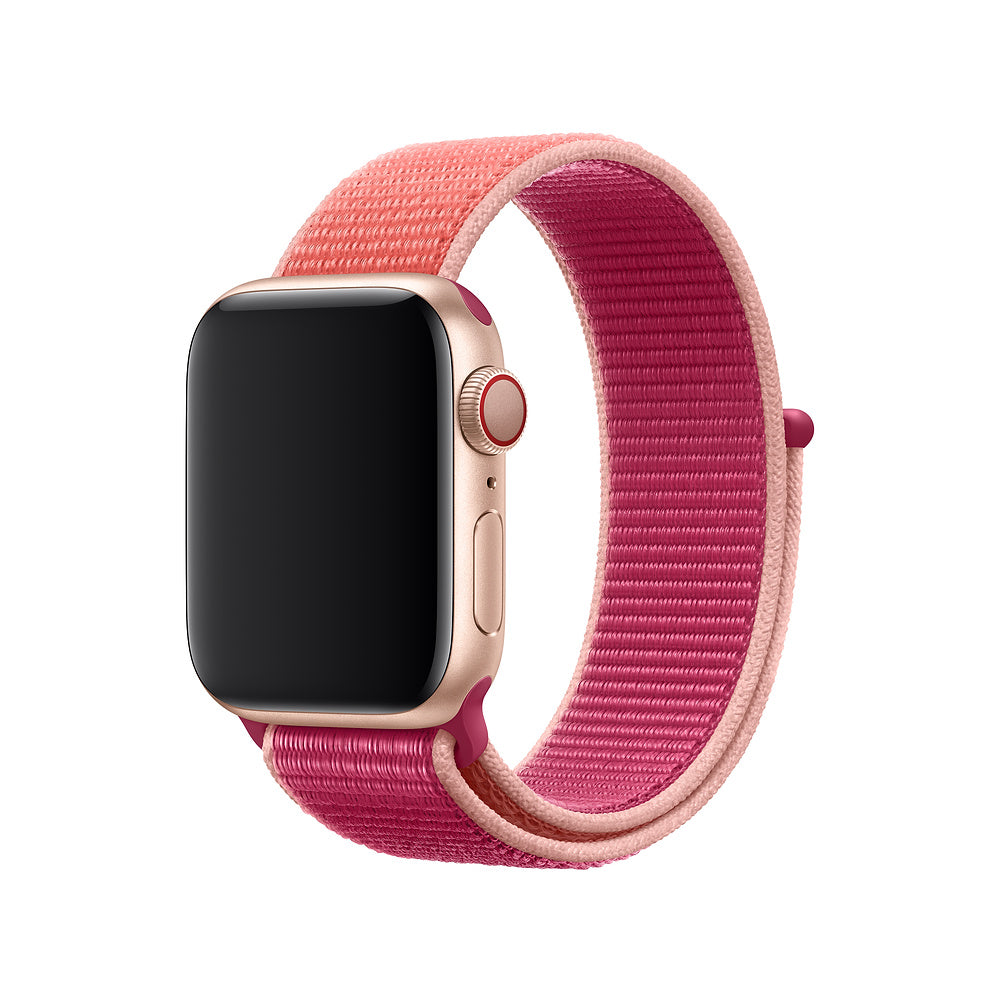 Rose gold Apple Watch with pink and magenta sport loop band, velcro closure fastener visible