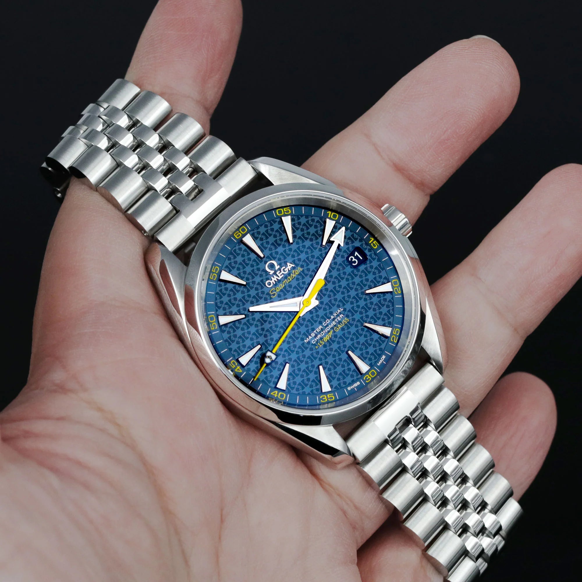 Stainless steel Super-Jub II bracelet watch with blue dial, white hour markers, yellow second hand, and solid metal jubilee link band on wrist
