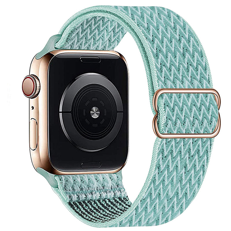 Gold aluminum Apple Watch with sage green woven loop band and rose gold magnetic closure clasp