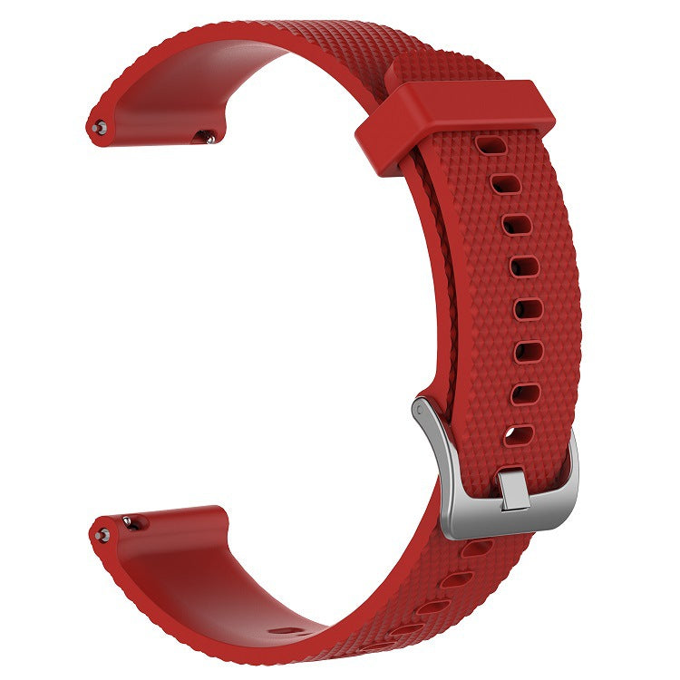 Red silicone smartwatch band with quick release connector and adjustable holes, isolated on white background