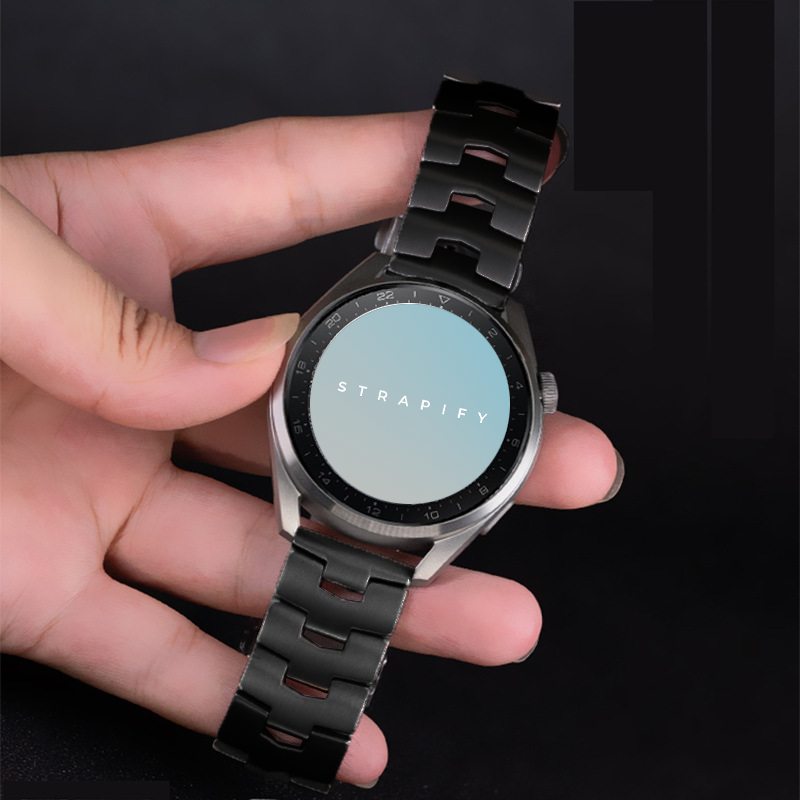 Titanium quick release bracelet 22mm with black metal links displayed on smartwatch held in hand