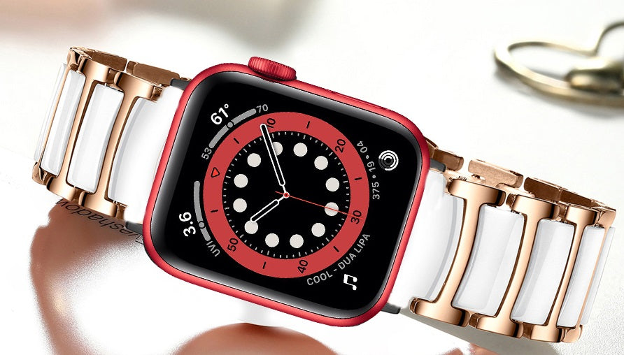 Red aluminum smartwatch with black digital dial and rose gold white ceramic steel link bracelet