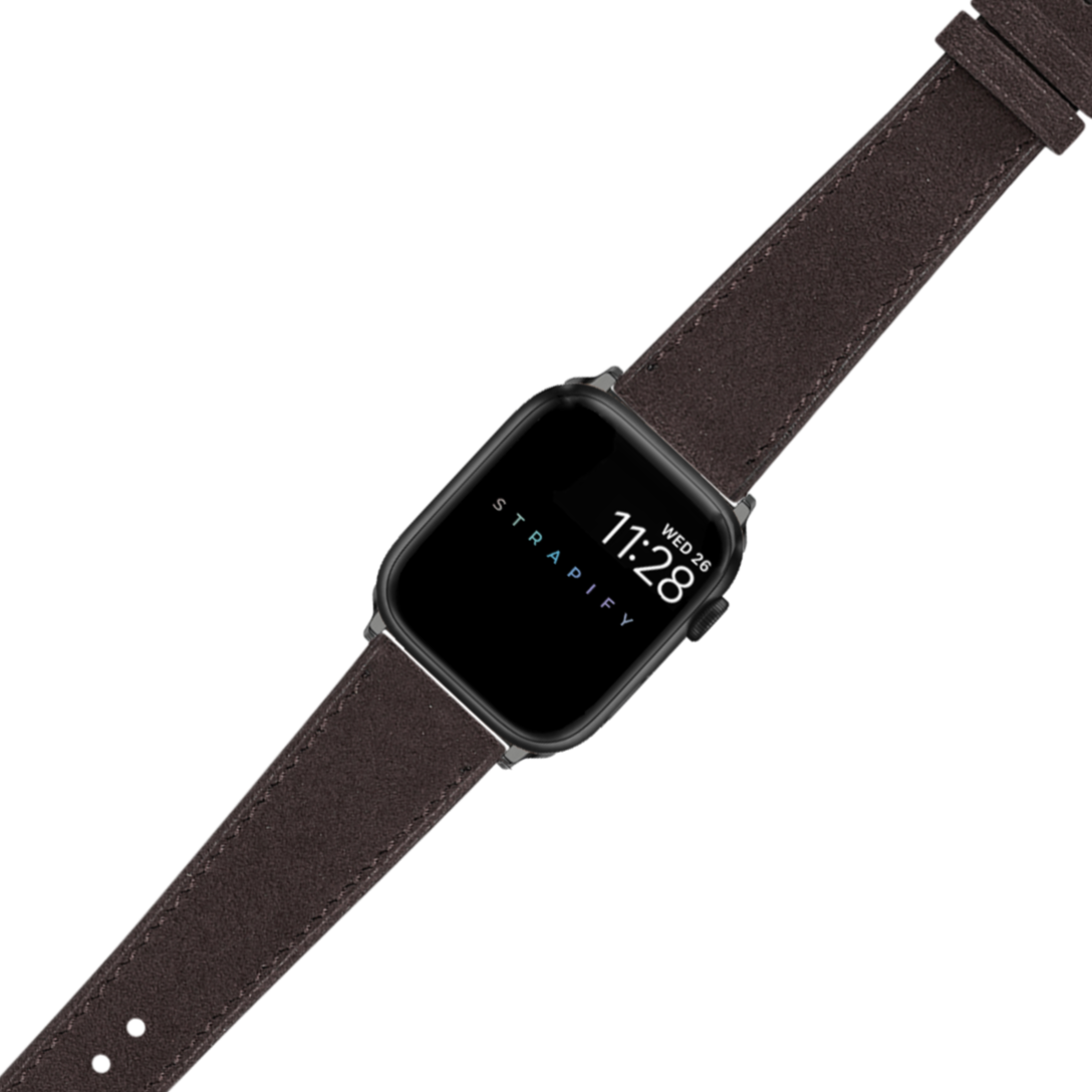 Black smartwatch with dark brown Alcantara leather band displaying time and date on screen