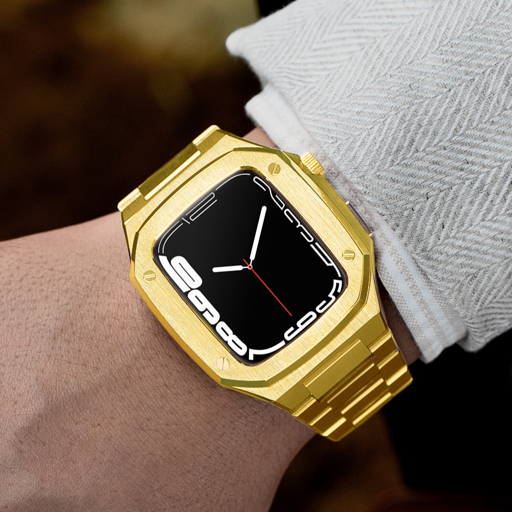 Gold stainless steel Apple Watch with black digital display and matching gold metal band on wrist