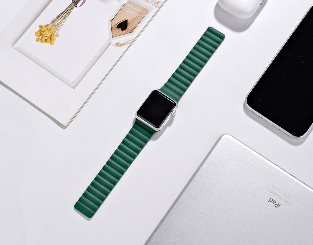 Green magnetic silicone loop smartwatch band with ribbed texture and metal magnetic closure for Apple Watch