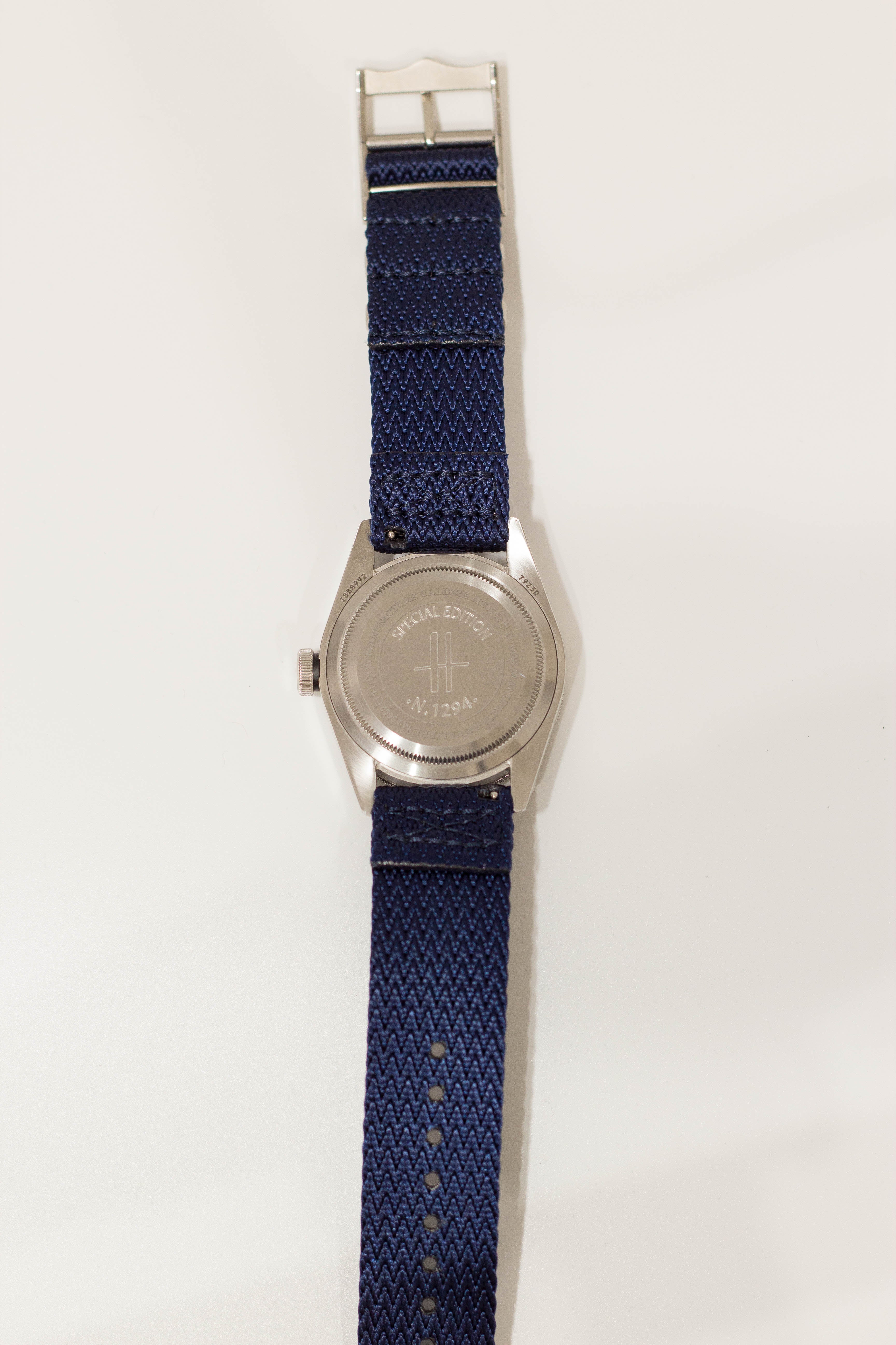 Silver-tone watch with navy blue Sharktooth Militex quick-release fabric strap and special edition engraved caseback
