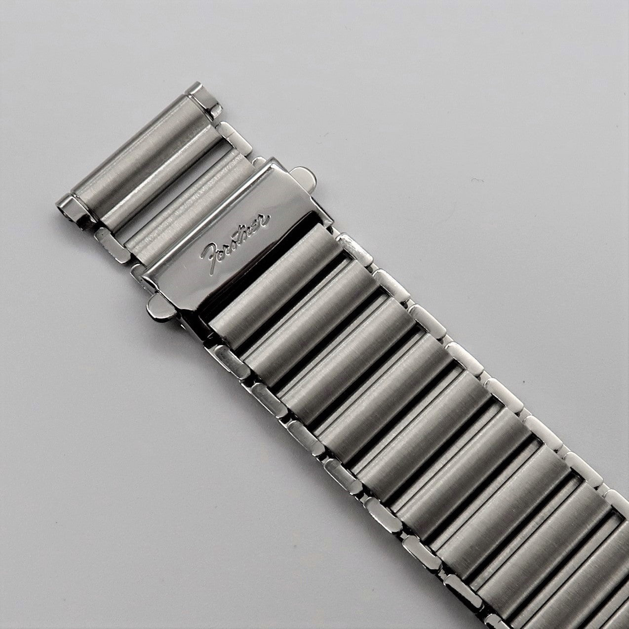 Stainless steel ladder-style watch bracelet with Forstner Klip closure and polished cylindrical links