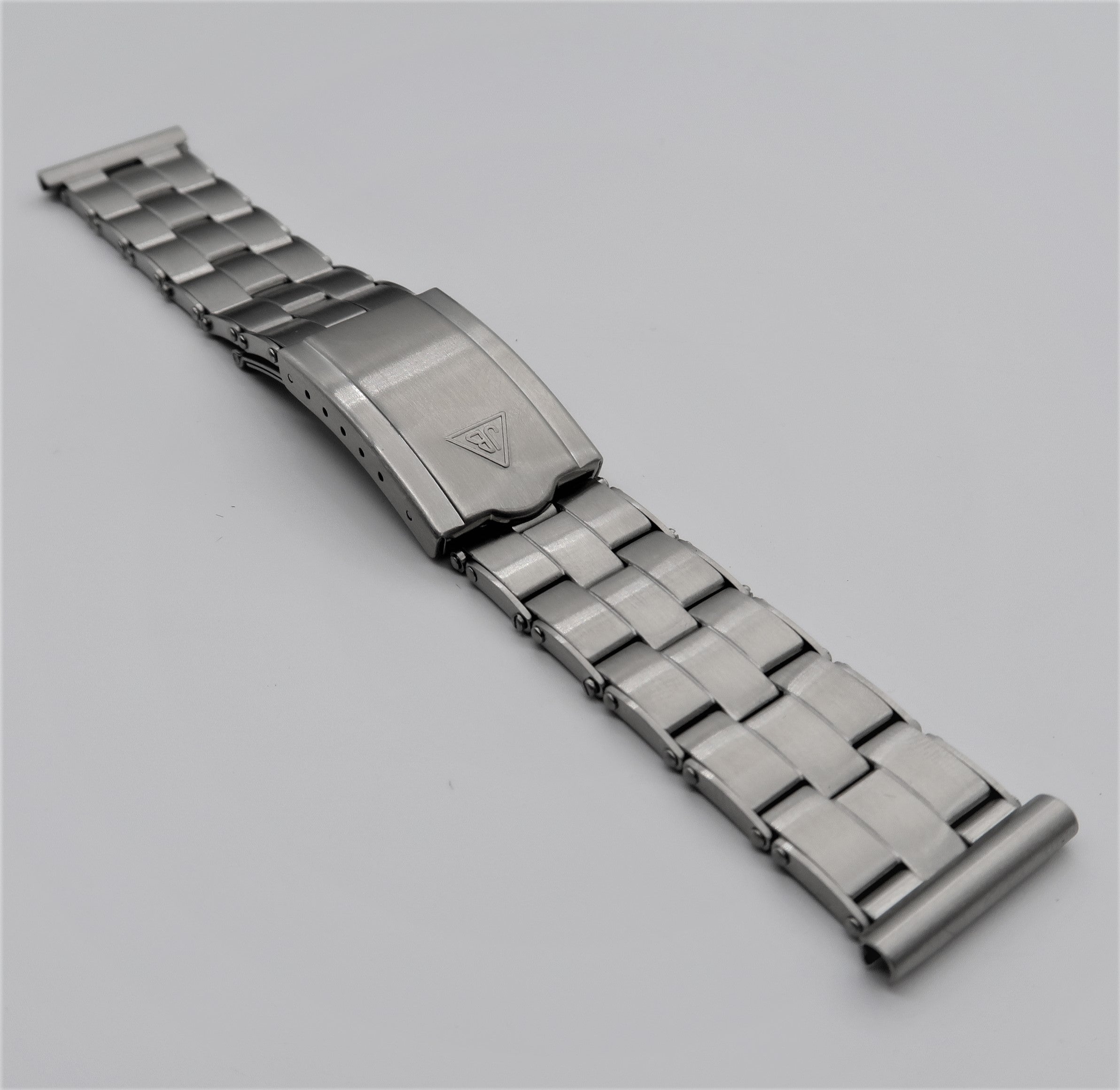 Stainless steel military-style rivet bracelet with solid link design and deployment clasp closure