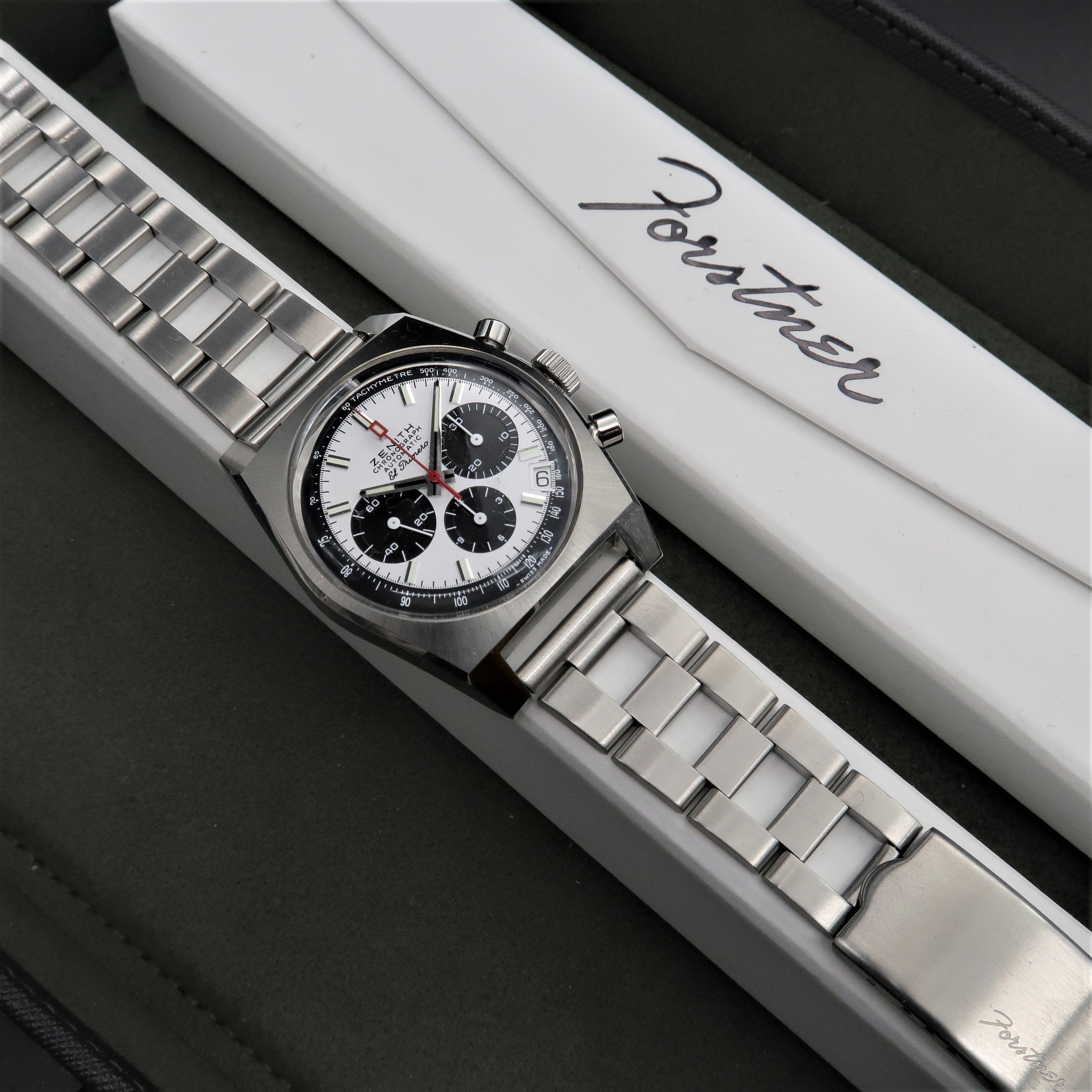 Men's chronograph watch with steel bracelet and black-white dial on white branded packaging