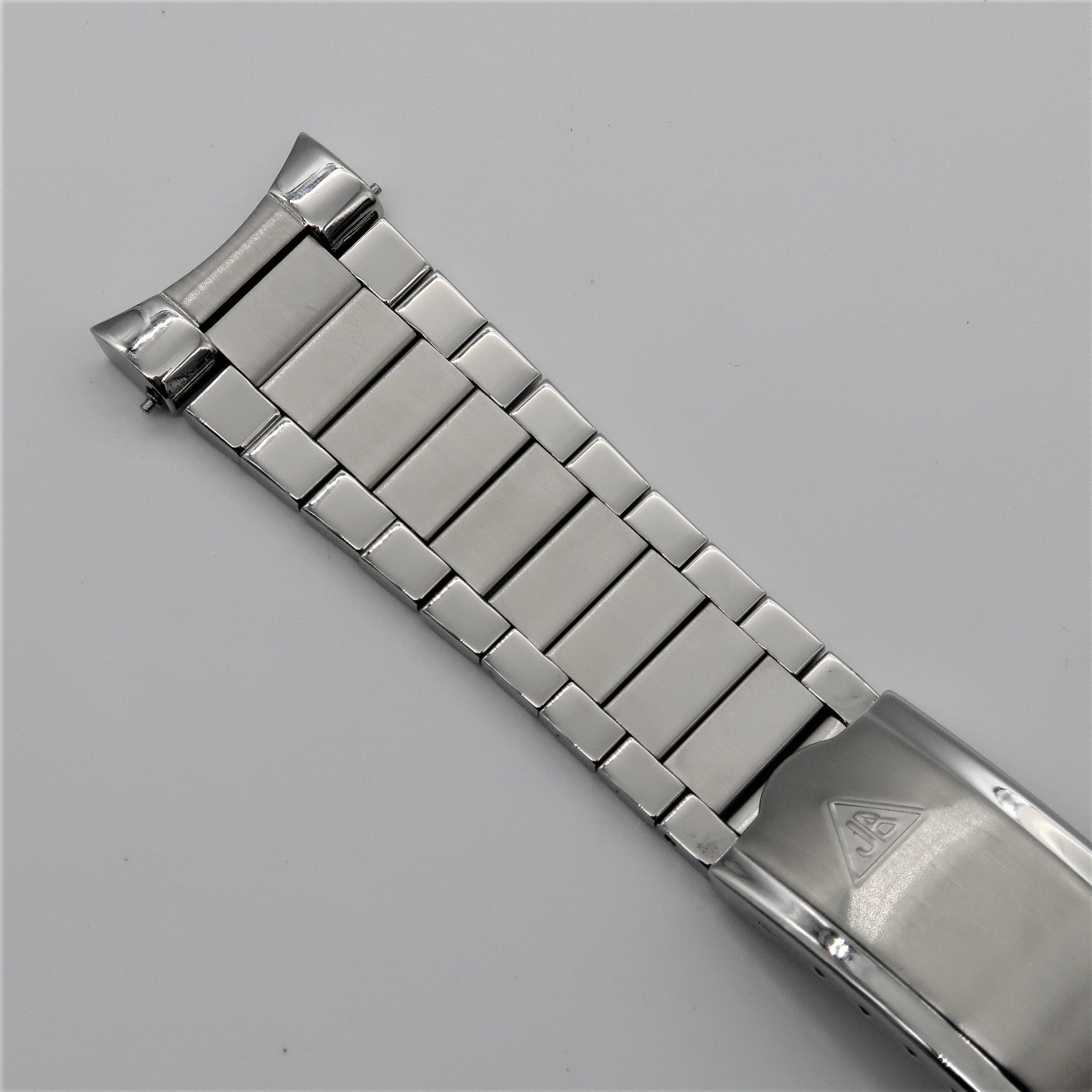 Stainless steel flat link bracelet for Omega Seamaster with polished links and integrated end links, shown on white background