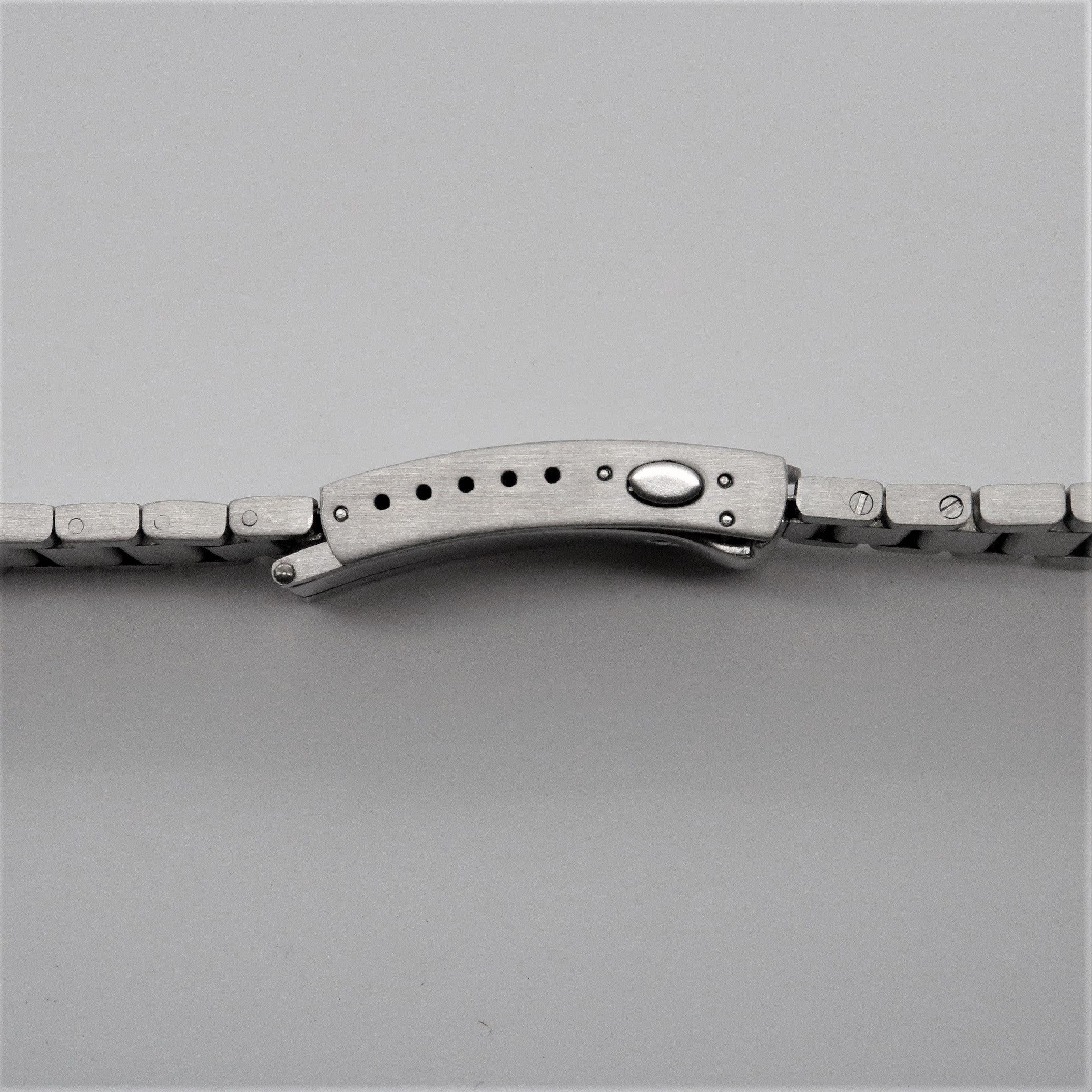 Stainless steel Omega Seamaster contemporary flat link bracelet with curved clasp and adjustment holes, side view