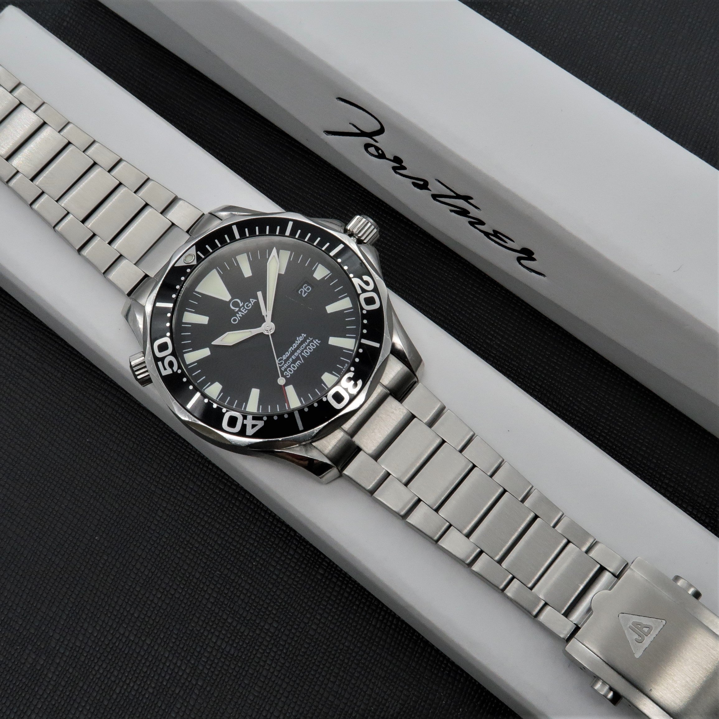 Stainless steel flat link bracelet for Omega Seamaster dive watch with polished and brushed finish links