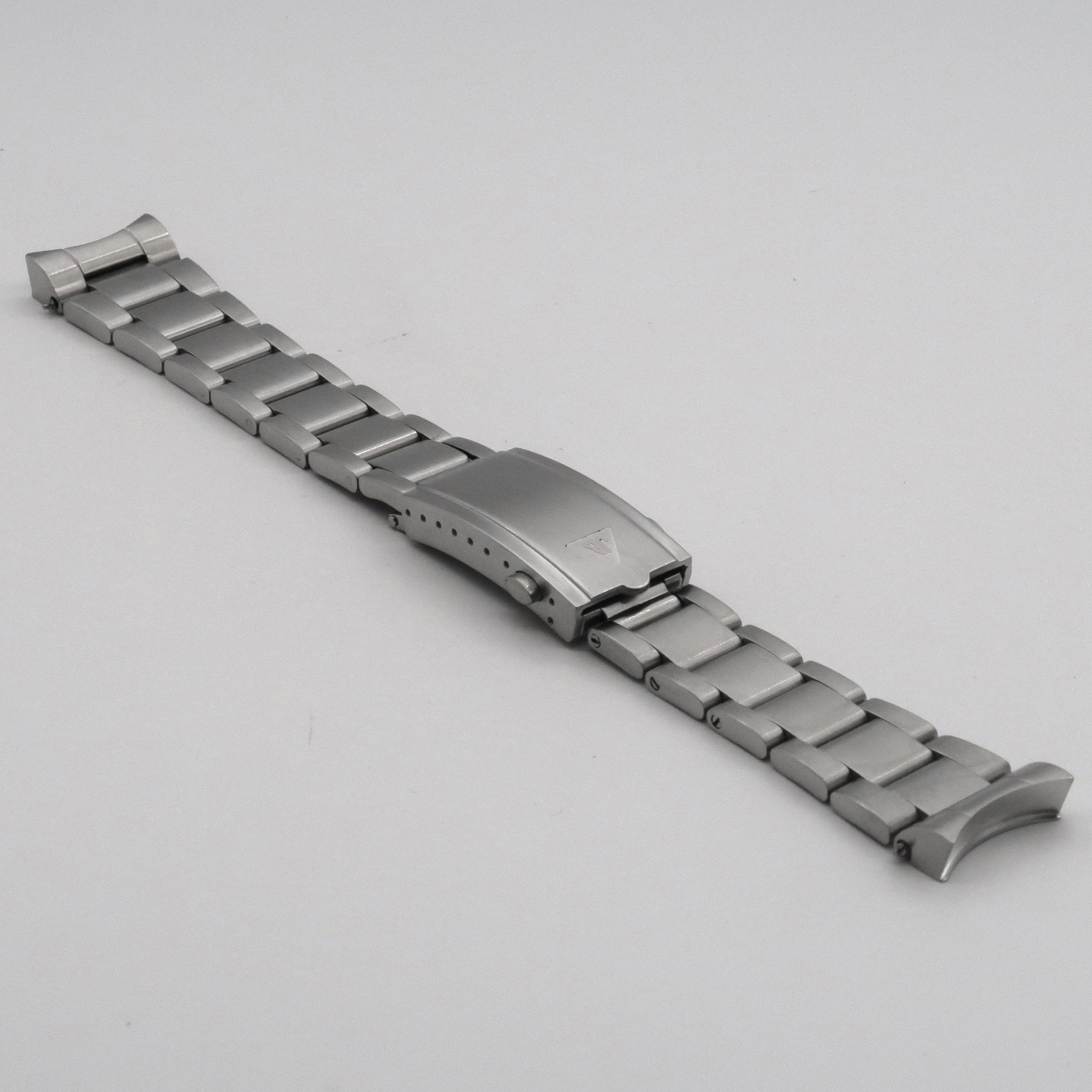 Stainless steel watch bracelet with fold-over clasp for Omega Seamaster, featuring solid link construction and polished finish