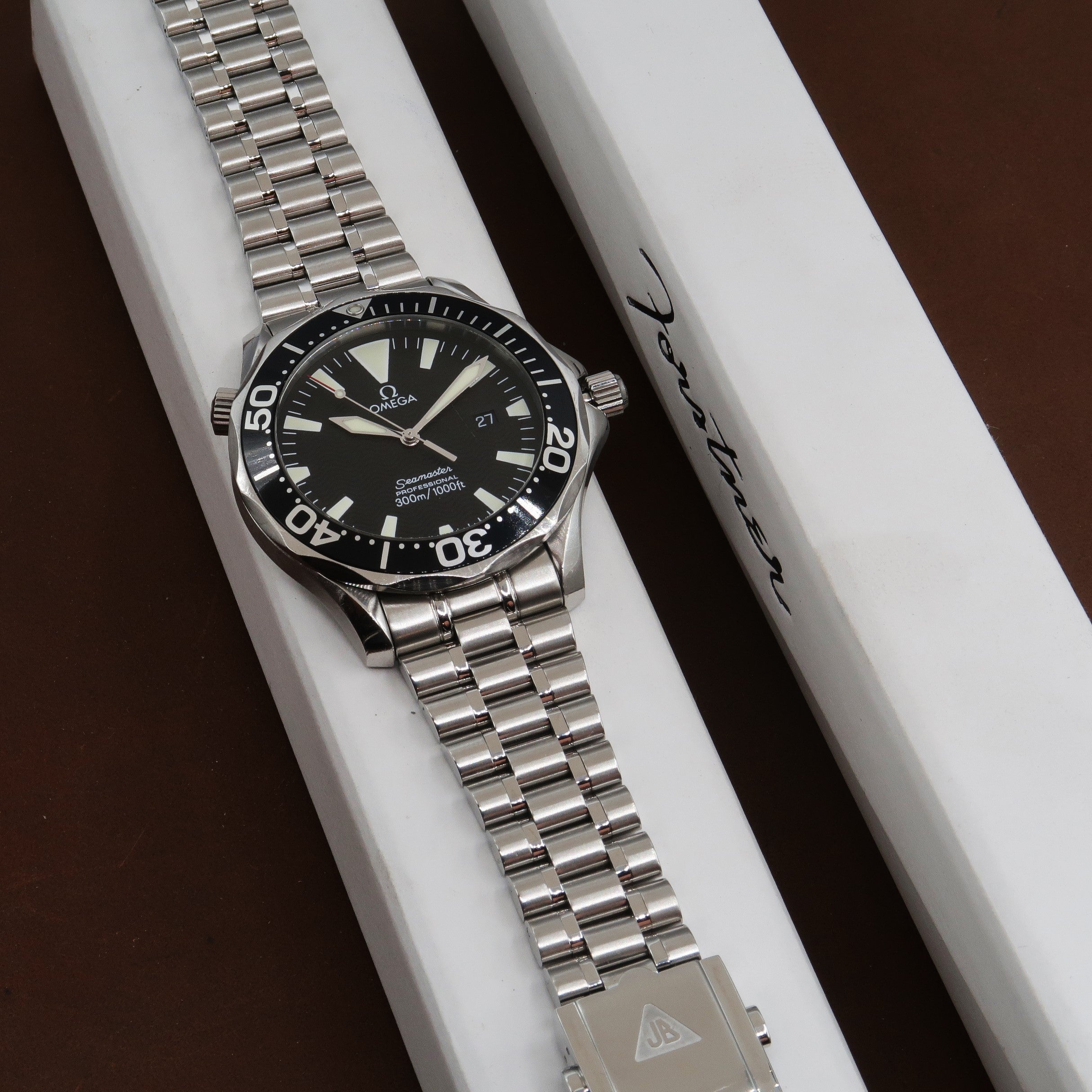 Omega Seamaster Professional 300M diver watch with stainless steel bracelet and black dial on white display box