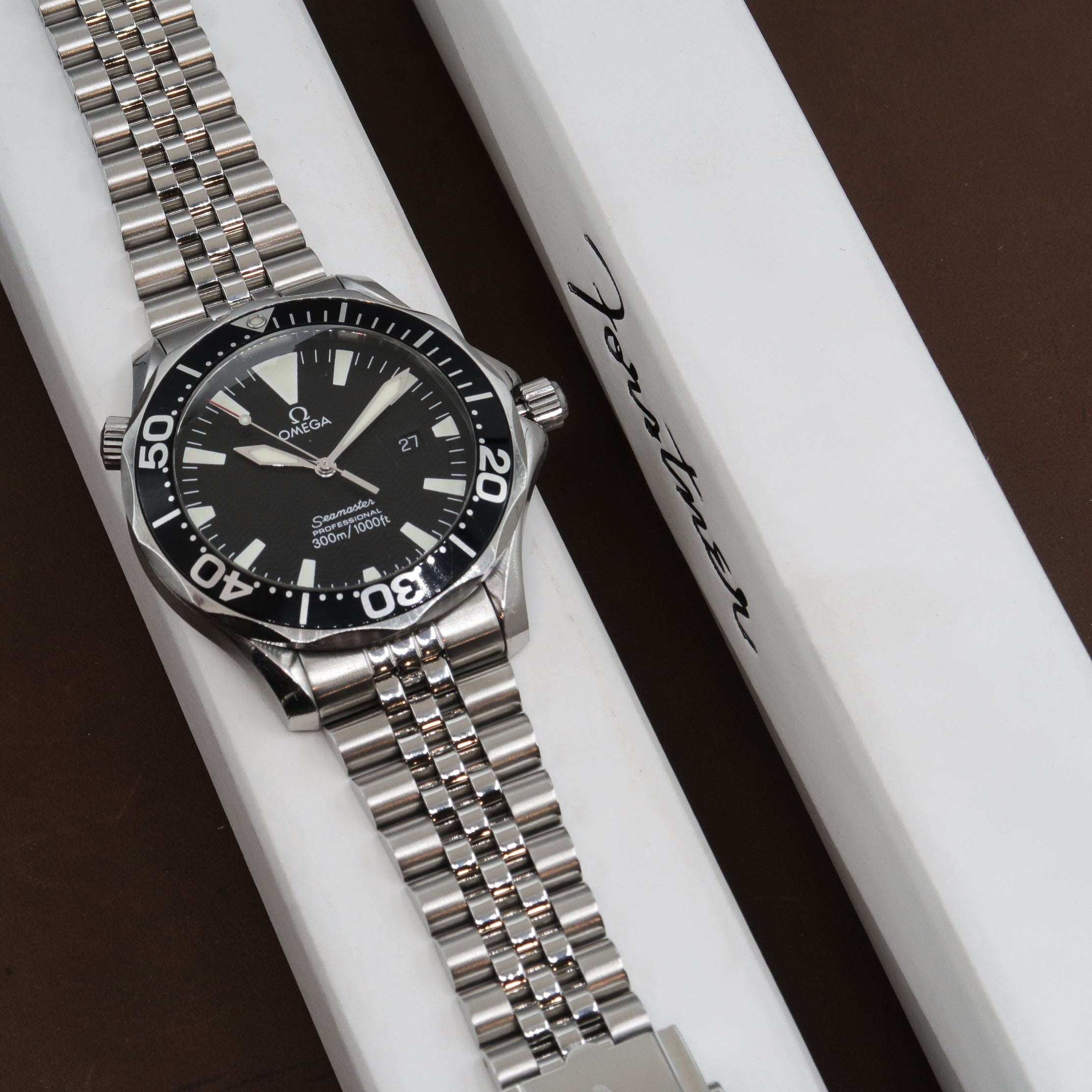 Omega Seamaster Professional 300M diver watch with stainless steel bracelet and black dial on white display box