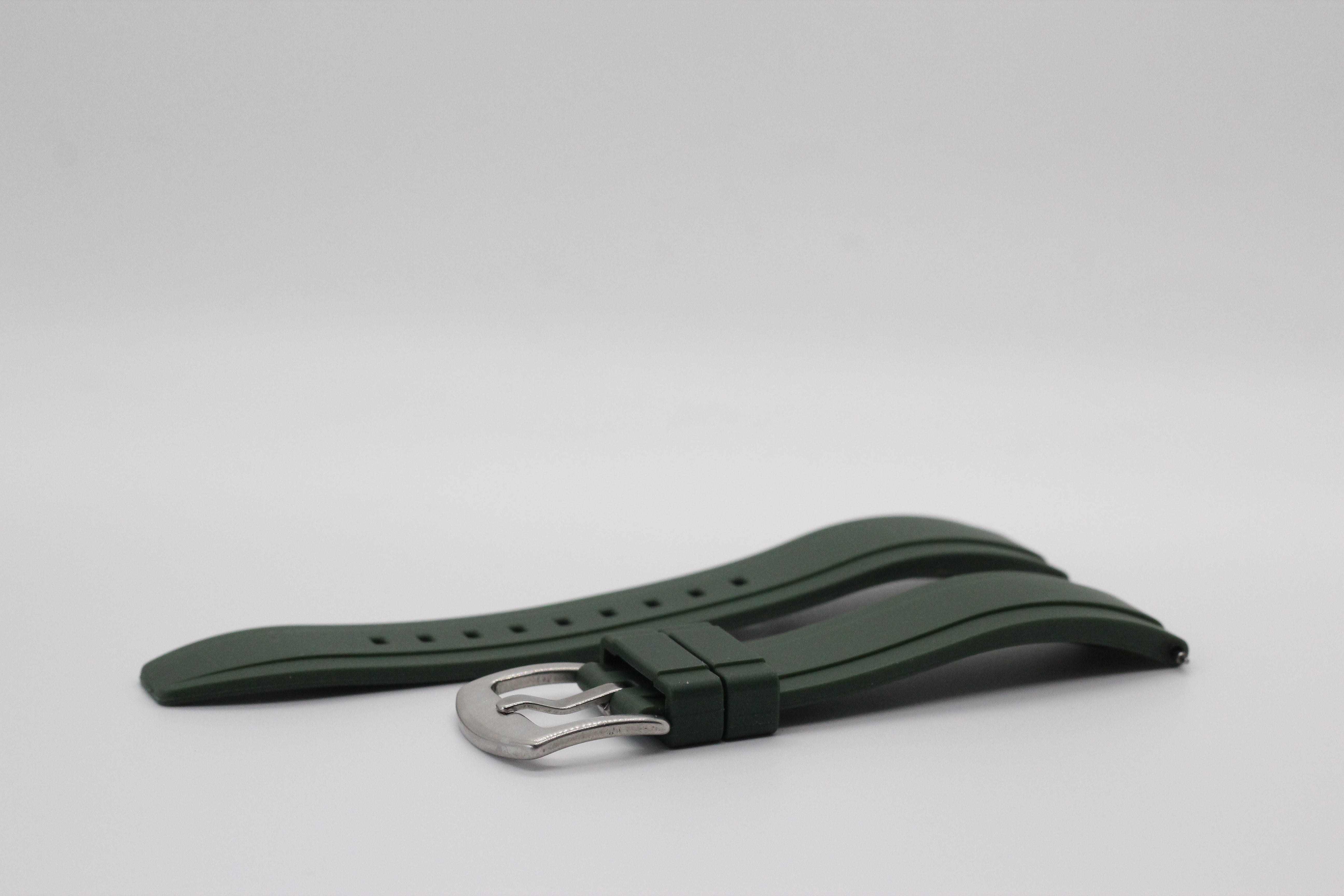 Green rubber watch band with quick release mechanism and silver buckle clasp