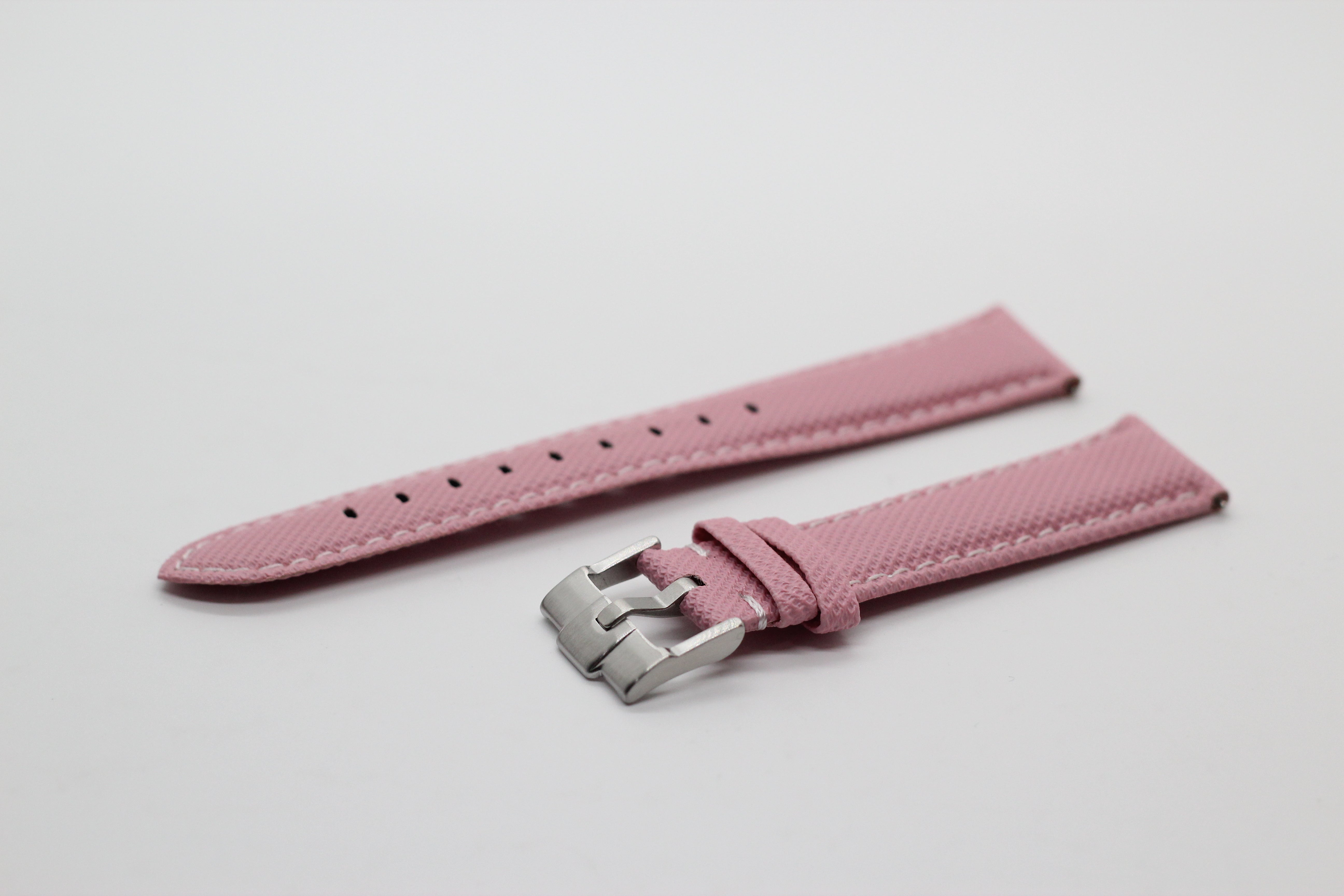 Pink sailcloth quick release watch band with stainless steel buckle and white stitching