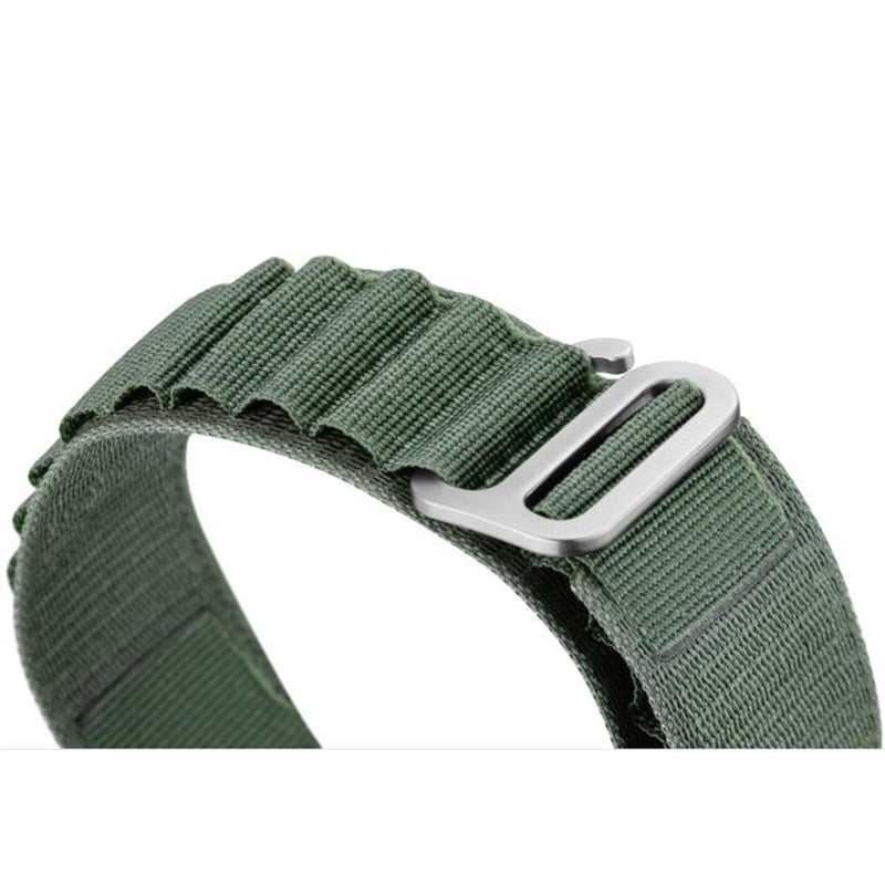 Sage green woven Alpine Loop band for Apple Watch with adjustable metal buckle closure