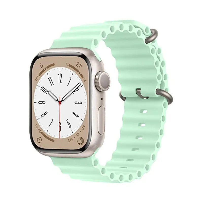 Silver stainless steel smartwatch with cream dial and mint green silicone ocean loop band with perforated design