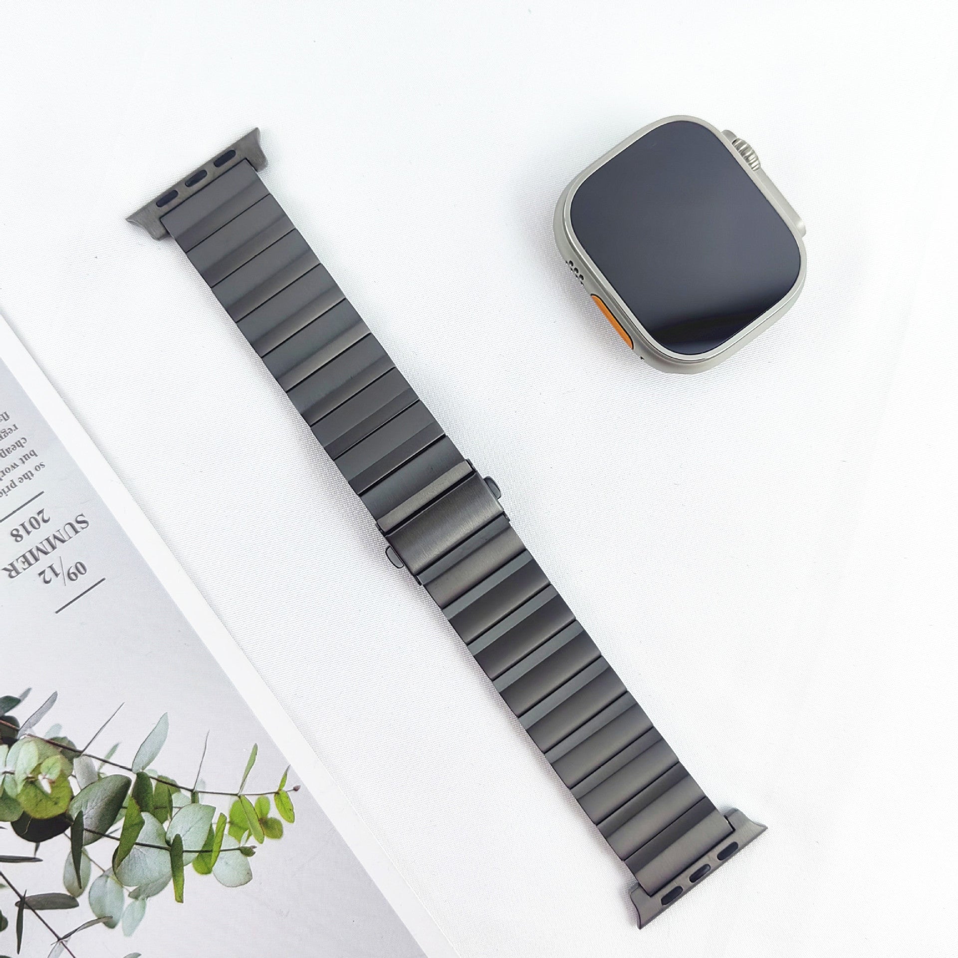 Titanium bracelet smartwatch band with segmented links and silver watchcase on white background