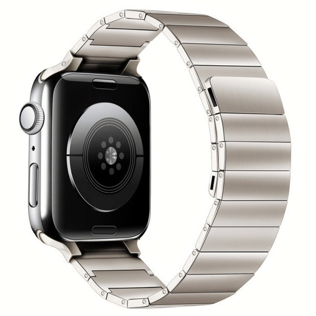 Silver stainless steel smartwatch with magnetic link bracelet and digital display showing fitness tracking sensor