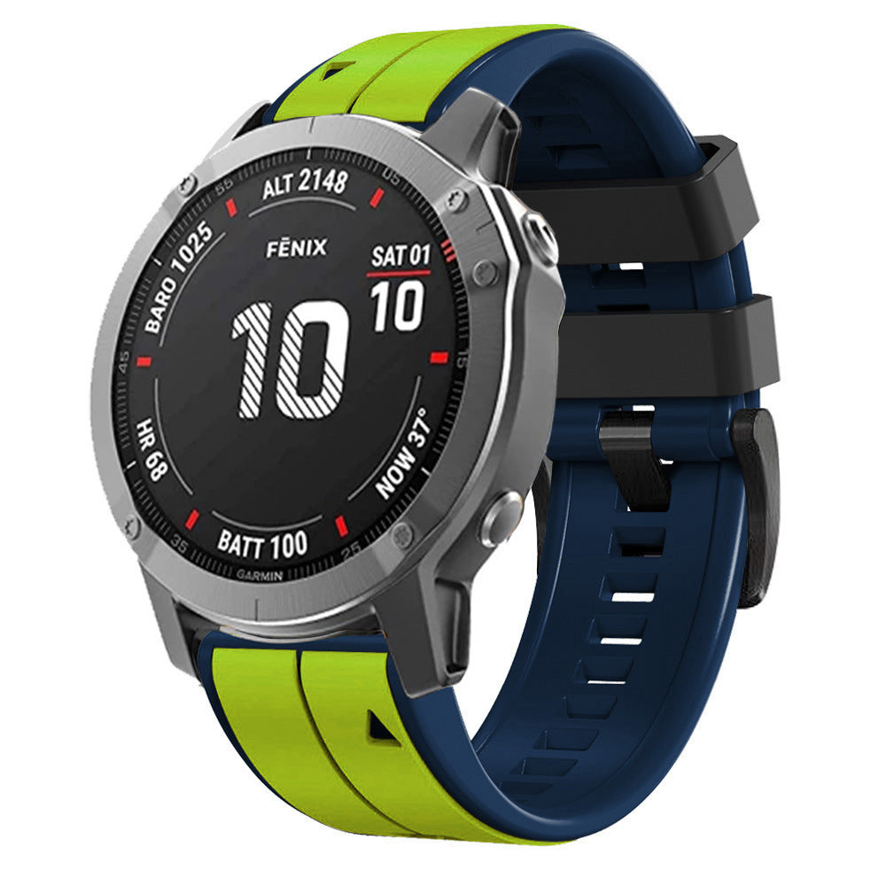 Garmin Fenix smartwatch with two-tone QuickFit silicone band in lime green and navy blue, digital display showing date and battery status