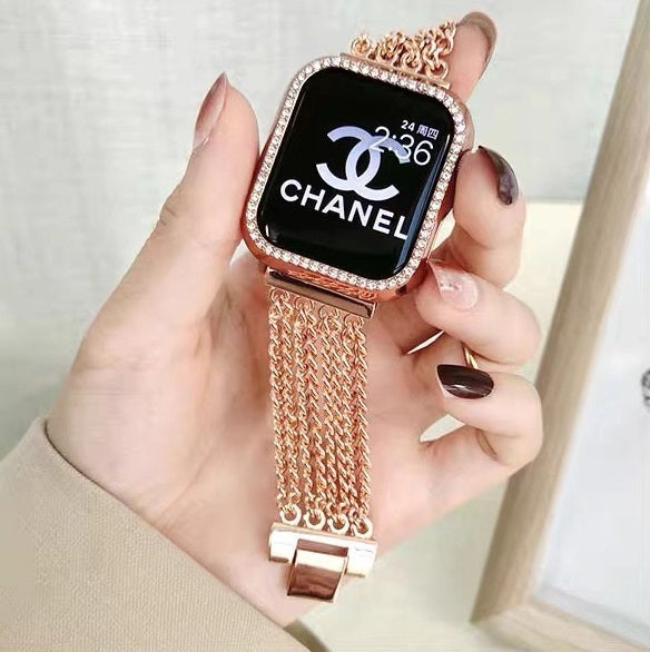 Rose gold chain mesh bracelet for Apple Watch with crystal rhinestone case held in hand