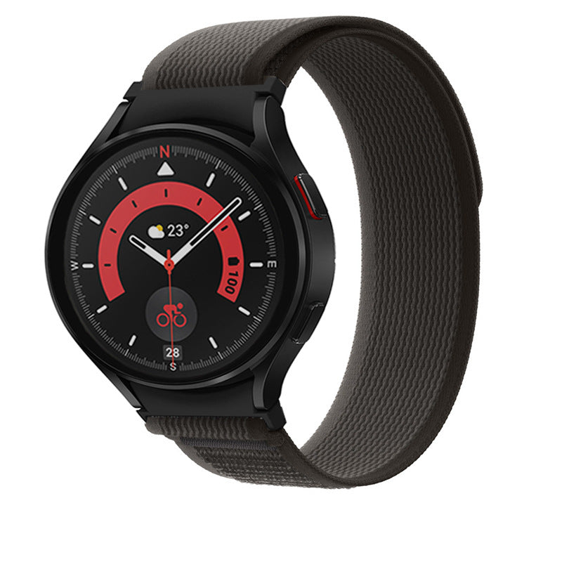 Black smartwatch with red dial and compass design, gray fabric loop band, displaying time and weather information