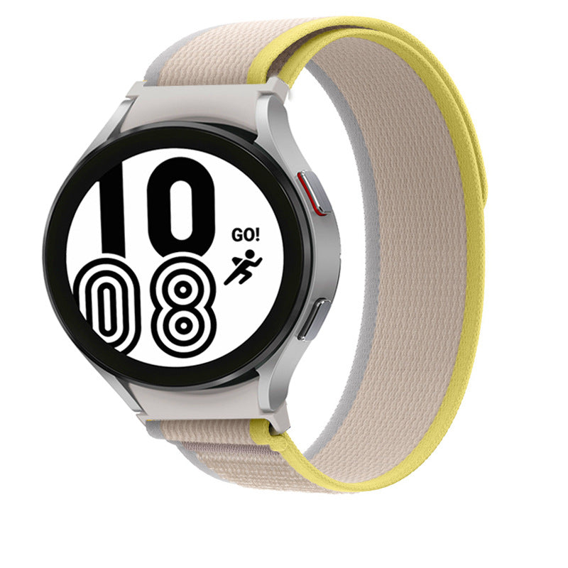 Samsung Galaxy Watch 4-7 with cream and yellow Trail Loop band, black dial displaying time 10:08