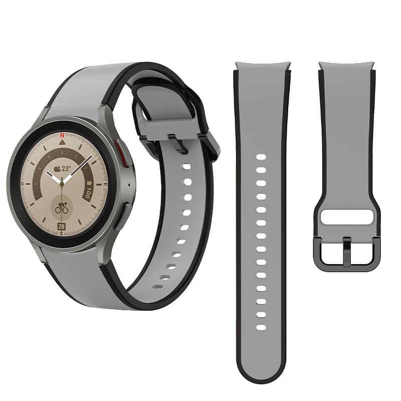 Two-tone gray and black silicone sport watch bands with quick-release pins displayed alongside smartwatch with analog dial and temperature display