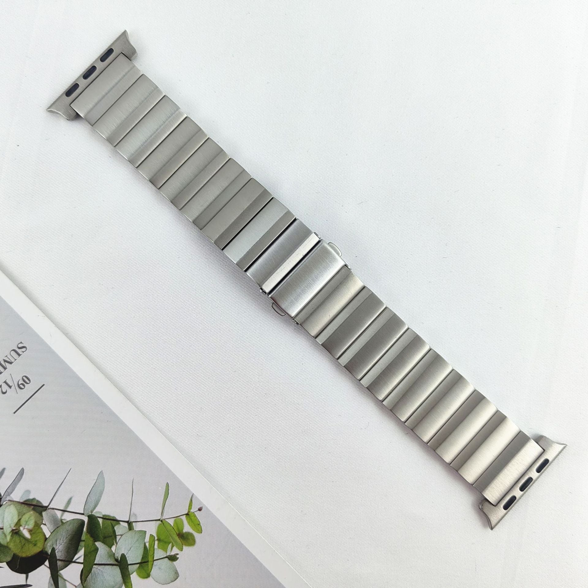 Titanium link bracelet for Apple Watch with adjustable metal band and connector lugs