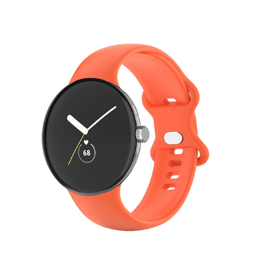 Coral silicone smartwatch band with black analog watch face displaying time and heart rate monitor on white background