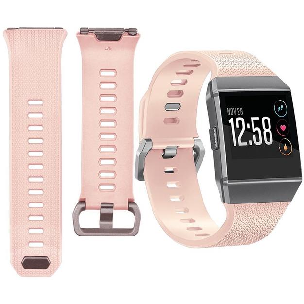 Three pale pink silicone watch bands for Fitbit Ionic with textured and perforated designs, displayed with smartwatch