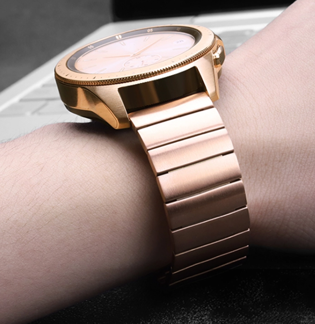 Rose gold steel watch bracelet with quick release deployment clasp on wrist, premium link design