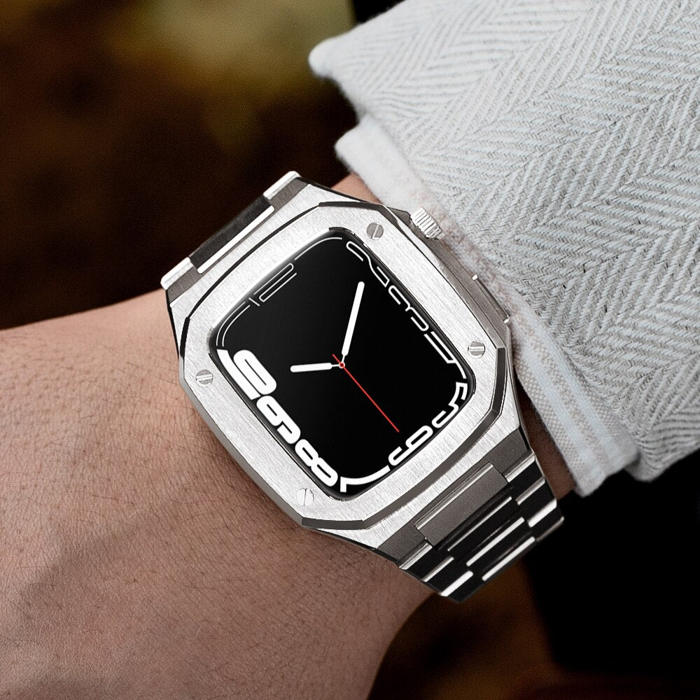 Silver stainless steel luxury watch with black digital dial and metal bracelet worn on wrist with light gray sweater sleeve
