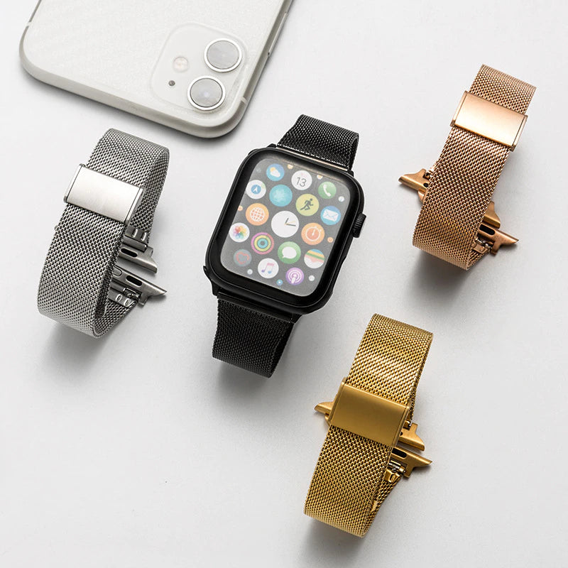 Smartwatch with interchangeable mesh band straps in silver, black, rose gold, and gold finishes with magnetic clasps
