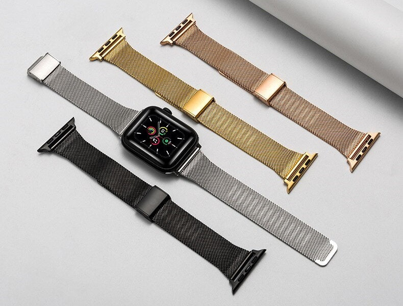 Smartwatch with interchangeable rose gold, gold, silver, and black mesh band straps featuring magnetic clasp closures