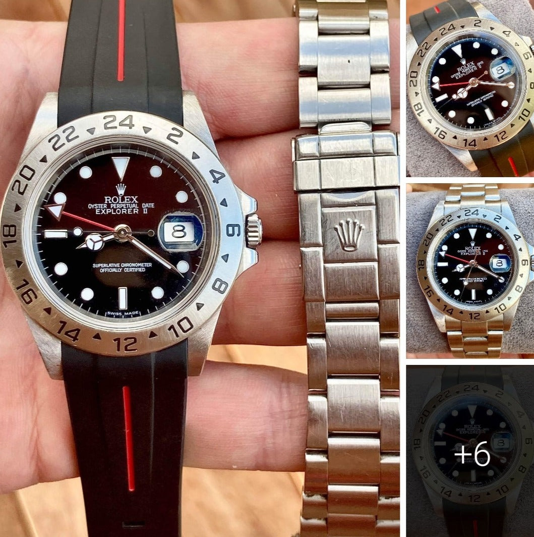 Rolex Explorer II stainless steel watch with dark red dial and GMT bezel on black rubber strap